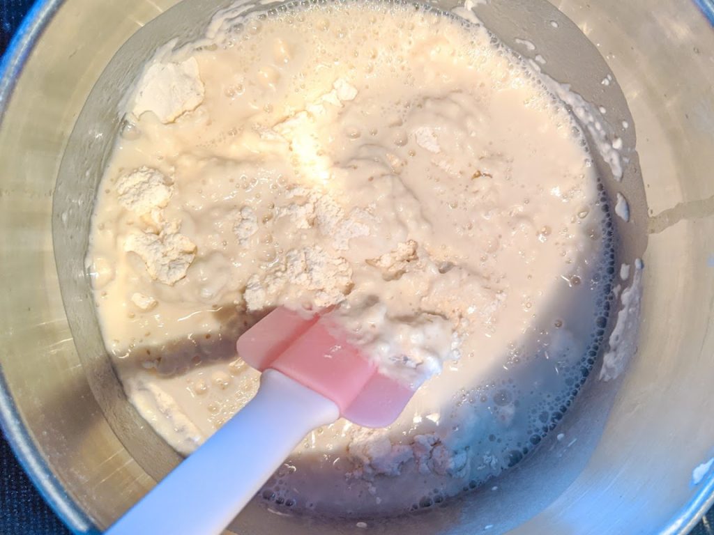 Putting the ingredients together in a pot to make the perfect homemade play dough 